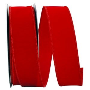 May include: A roll of red velvet ribbon with a wired edge. The ribbon is approximately 1.5 inches wide.