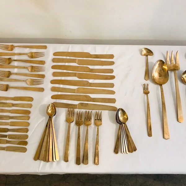 A complete vintage 144 piece nickel bronze flatware cutlery serving set