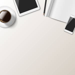May include: A white desk with a cup of coffee, a tablet, a smartphone, a pencil, and a magazine.