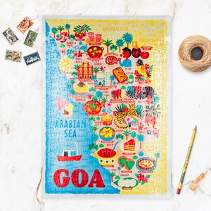 May include: A colorful jigsaw puzzle depicting a map of Goa, India. The puzzle features illustrations of various landmarks, food, and animals. The puzzle is made of 500 pieces and is perfect for adults and children.