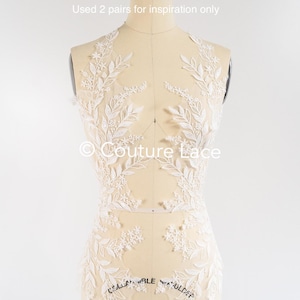 May include: White floral lace applique with delicate leaves and flowers. The lace is shown on a dress form. "Used 2 pairs for inspiration only" and "Couture Lace" are written on the image.
