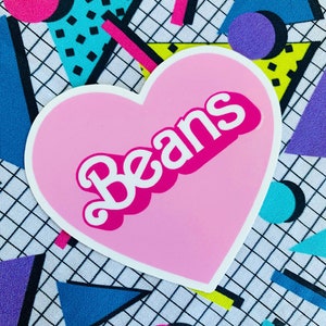 May include: A pink heart-shaped sticker with the word "Beans" in white letters with a pink outline. The sticker is on a background of colorful geometric shapes.