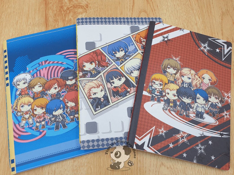 May include: Three different notebooks with colorful covers featuring anime characters from the Persona series. The covers are blue, gray, and red with black and white stars.
