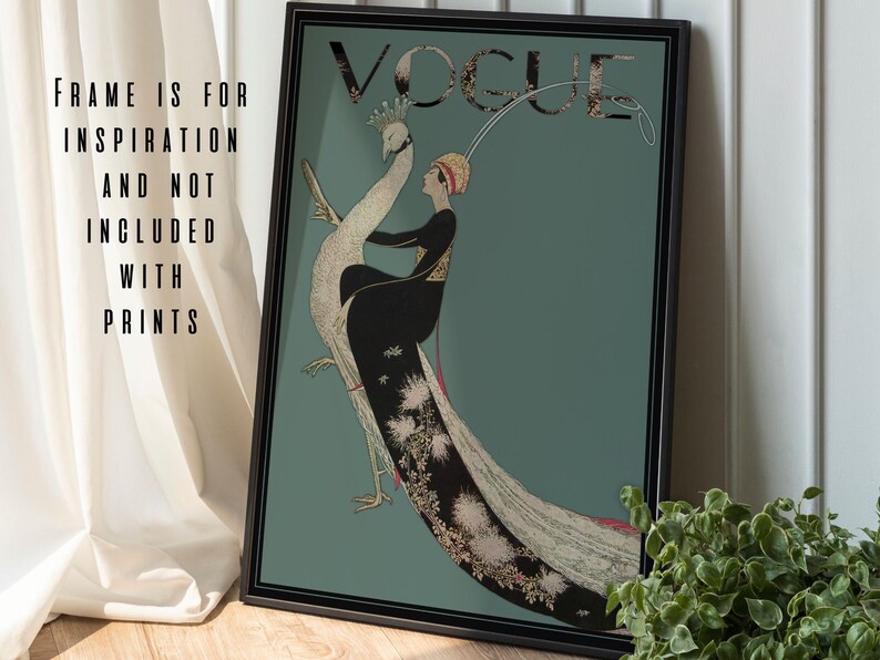 May include: A framed vintage Vogue magazine cover print. The artwork features a woman in a black dress riding a peacock against a teal background. The Vogue logo is at the top. Text on the left side reads "FRAME IS FOR INSPIRATION AND NOT INCLUDED WITH PRINTS."