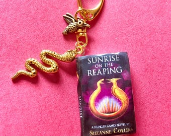 Hunger Games Sunrise on the Reaping Keychain: Battered Book, Bird and Snake Charms