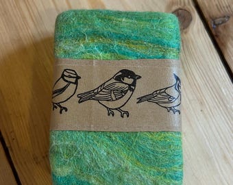 Lemongrass soap, felted with merino wool and tussah silk.