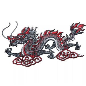May include: Embroidered patch with a dragon design. The dragon is mainly black and grey, with red detailing on the head, spine, and tail. It is shown with stylised clouds in red and white.