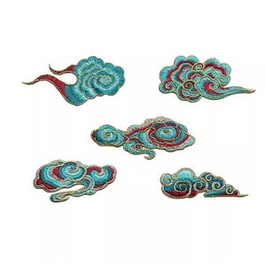 May include: Five embroidered cloud patches in teal, red, and gold. The patches feature swirling designs on a white background. These patches are suitable for adding a decorative touch to clothing or accessories.