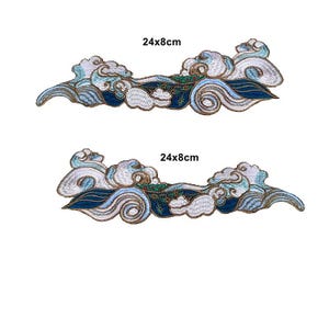 May include: Two embroidered patches featuring a stylized wave and cloud design in shades of blue, white, and green with gold outlines. Each patch measures 24x8cm as indicated by the text printed above each piece in the image.