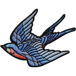 May include: A blue and red embroidered swallow bird patch. The bird is flying with its wings spread out. The patch is perfect for adding a touch of vintage style to jackets, bags, or other items.