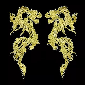 May include: Two symmetrical gold embroidered dragon patches featuring intricate scale detailing and flowing serpentine bodies. Each dragon is depicted in a mirrored pose with raised heads and extended claws, rendered in metallic gold thread against a black background.
