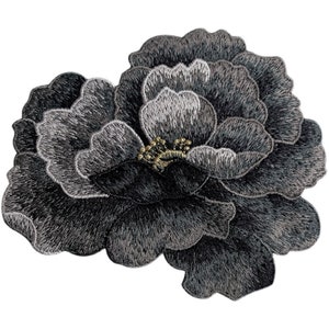May include: A black embroidered flower patch with a silver sheen and gold accents. The flower is a single bloom with multiple layers of petals.