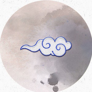 May include: White embroidered cloud patch with a swirling design. The patch is ideal for adding a touch of whimsy to clothing, bags, or other crafts.