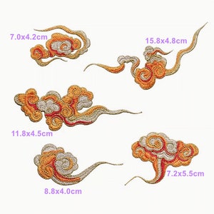 May include: Five embroidered patches in the shape of clouds. The clouds are orange, red, and gold with a silver thread. The patches are different sizes and shapes. The largest patch is 15.8 x 4.8 cm. The smallest patch is 7.0 x 4.2 cm.