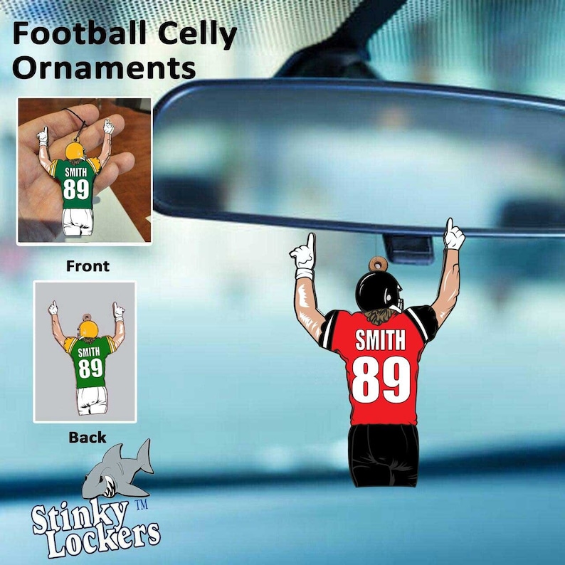 May include: A red and black football player figurine with the name "SMITH" and the number "89" on the back of the jersey. The figurine is hanging from a rearview mirror in a car.