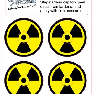 May include: Four yellow and black radiation symbol stickers. The stickers are round and have a black radiation symbol on a yellow background. The text "Headset Cap Decals" is at the top of the image. The text "Steps: Clean cap top; peel decal from backing; and apply with firm pressure." is below the title.