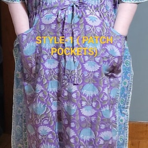 May include: A purple and blue floral print dress with patch pockets. The dress has a tie at the waist and short sleeves. The text "STYLE-1 (PATCH POCKETS)" is visible on the front of the dress.