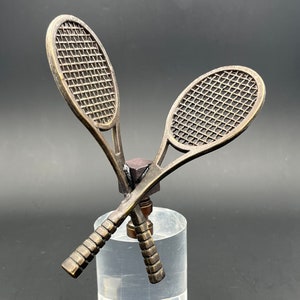 Custom Lamp Finial Featuring A Pair of Cross Tennis Racquets