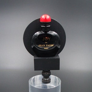 Custom Lamp Finial Featuring a miniature Bottle  Perfume on a Matt Black Base with a Circular Black Backer Panel
