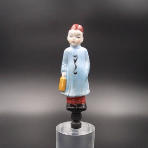 Custom Lamp Finial Featuring a Young Chinese Boy in a Blue Tunic Holding a Lunch Pail.