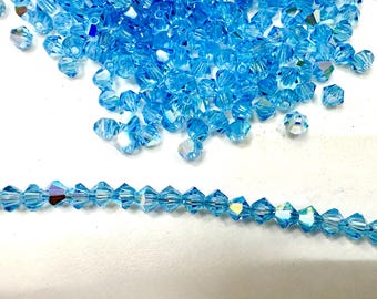 Swarovski Aquamarine AB Doppelkegel Perlen (3/4 mm)