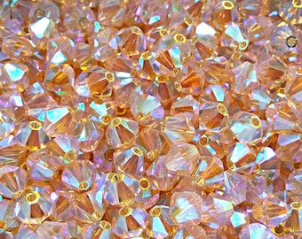 Cuentas bicónicas Swarovski Light Peach AB de 3/4 mm