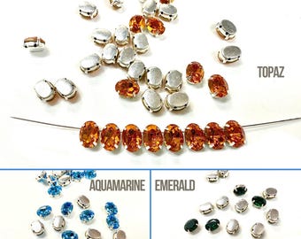 Swarovski 8 x 6 mm ovaal kristal, zilveren stekels