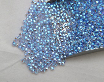 Swarovski Light Sapphire AB Doppelkegel Perlen, 3/4 mm, Schmuckzubehör