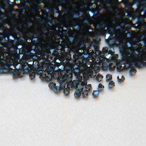 Cuentas bicono de cristal Swarovski azul metálico (4 mm) Suministros para manualidades