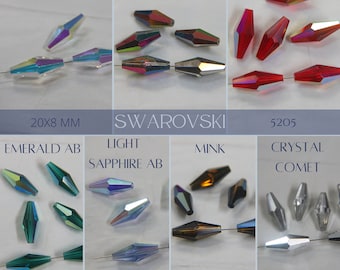 May include: Assortment of Swarovski crystal beads in various colours and finishes, including Crystal AB, Vitrail Medium, Light Siam AB, Emerald AB, Light Sapphire AB, Mink, and Crystal Comet. The beads are 20x8 mm and are strung on a wire.