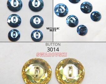 May include: Two round, clear, light topaz colored Swarovski crystal buttons with two holes. The buttons are 3014 size and are shown against a white background. The text "BUTTON 3014 SWAROVSKI" is above the buttons and the text "LIGHT TOPAZ" is below the buttons.