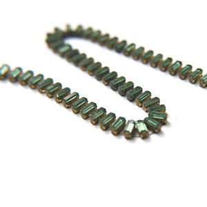 Swarovski Snake Baguette chain 7x3 mm in Erinite settings in Brass
