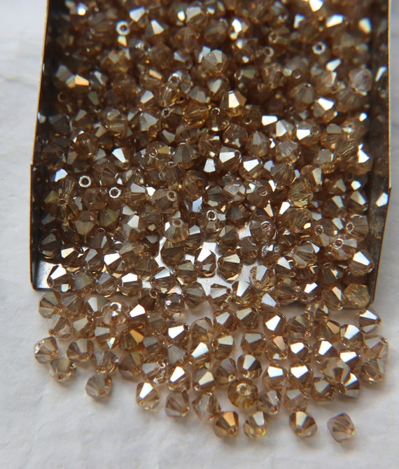 Buy Swarovski 5020 4mm Helix Beads Crystal AB (36 pieces)