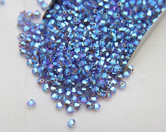 Swarovski (3/4mm) Tanzanite AB 2X FC Bicones Rainbow Beads