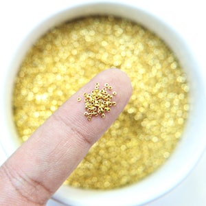 1 mm Micro Gold Plated Tube Perlen 5/10/100/500 Gramm Hochwertige Nail Art Dekoration / Haute Couture Stickerei / Puppenherstellung / seltene Versorgung