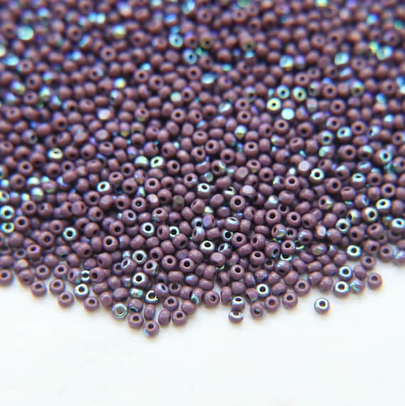 Buy 11/0 Charlotte Cut Beads Patina Opaque Amethyst Aurore Boreale