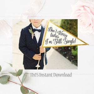 May include: A young person in a navy blue suit holds a triangular sign with gold trim. The sign reads "Don't Worry ladies. I'm Still Single!" in elegant script. The sign is cream-colored with gold trim. The words "11x15 Instant Download" are at the bottom.
