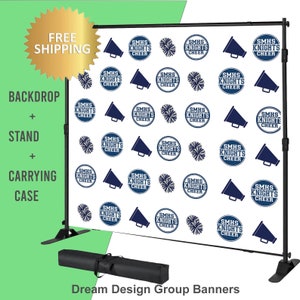 May include: A white backdrop with a repeating pattern of blue megaphones and cheerleading pom-poms with the text "SMHS Knights Cheer". The backdrop is attached to a black stand with a black carrying case.