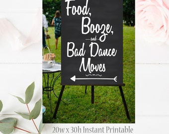 May include: A black chalkboard sign on a wooden easel with the words "Food, Booze, and Bad Dance Moves" in white script. An arrow points left. The sign is 20 inches wide and 30 inches high.