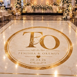 May include: A white marble-patterned dance floor decal featuring a large gold circular border and the gold monogram letters T and O. The text reads TENISHA & OKEMUS with a heart icon and the date 10.24.26 centered below the letters.