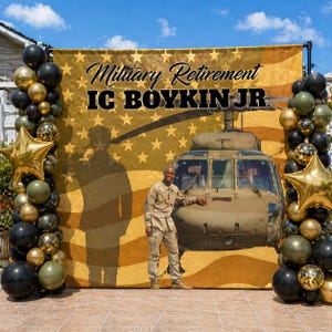 May include: A backdrop for a military retirement celebration, with a helicopter and the text "Military Retirement IC BOYKIN JR." The backdrop is gold with a star pattern and a person's silhouette. Black, gold, and olive green balloons decorate the sides.