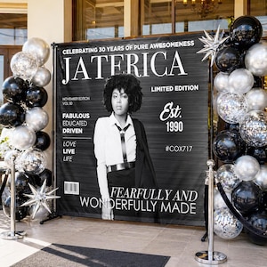 May include: A black and white banner with the text "JATERICA" and "Celebrating 30 Years of Pure Awesomeness." A person in a white shirt and black tie stands in front of the banner. Black, silver, and confetti balloons frame the banner.