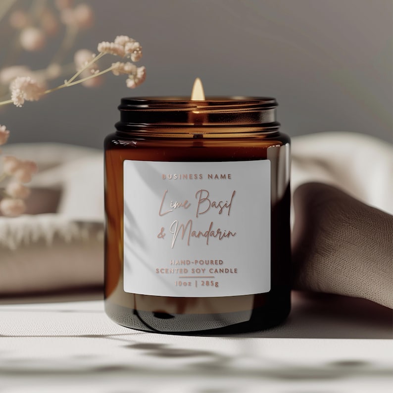 May include: A brown glass candle jar with a white label that reads "BUSINESS NAME Lime Basil & Mandarin HAND-POURED SCENTED SOY CANDLE 10oz | 285g".