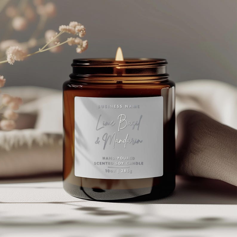 May include: A brown glass candle jar with a white label that reads "BUSINESS NAME Lime Basil & Mandarin HAND-POURED SCENTED SOY CANDLE 10oz | 285g".