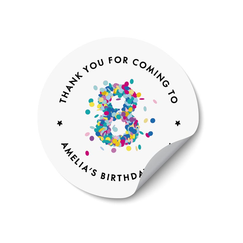 May include: A white, circular sticker with a curled edge. The sticker displays the text "THANK YOU FOR COMING TO AMELIA'S BIRTHDAY" in black, encircling a colourful confetti-filled number 8. Two small black stars are also present.