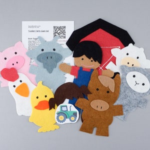 May include: Felt farm play set with a barn, a farmer, a pig, a cow, a sheep, a duck, a chicken, a horse, and a tractor. The set is designed for toddlers and includes a QR code for additional activities.