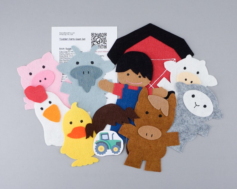 May include: Felt farm play set with a barn, a farmer, a pig, a cow, a sheep, a duck, a chicken, a horse, and a tractor. The set is designed for toddlers and includes a QR code for additional activities.