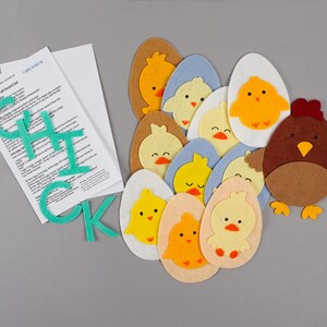 Chicken flannel board pieces with letters CHICK and lyric cards.