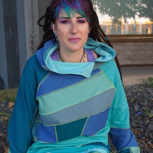 Handmade NoWaste PatchworkHoodie in BlueGreenGreenGreyTons with fluorescent outer seams in size.M/L with large lined hood, unique