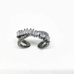 X Ring with Baguettes ; Criss Cross Ring with Baguettes ; Adjustable Ring ; Baguette Ring ; Curled Over Ring ; Crossover Ring